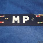 WW2 era U.S. MP armband with vet decorations