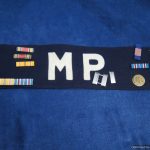WW2 era U.S. MP armband with vet decorations