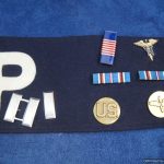 WW2 era U.S. MP armband with vet decorations