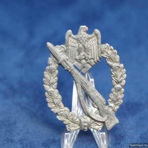 Although found commonly with some other awards, H.A. Infantry assault badges are rather scarce. This one shows some zinc pest developing as well as a missing section of wreath. The hinge and catch remain in excellent condition. Nice detail on these Aurich eagles