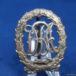 DRA Sports badge in Silver