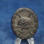 Black Wound Badge by Klein & Quenzer A.G. Marked "65"