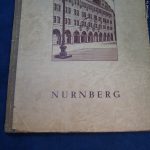 1946 Nurnberg trials book issued by the 3rd Army to guard in the first Division Signed