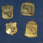 4pc Set of pistol badges by Blackinton