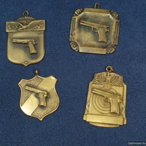 4pc Set of pistol badges by Blackinton