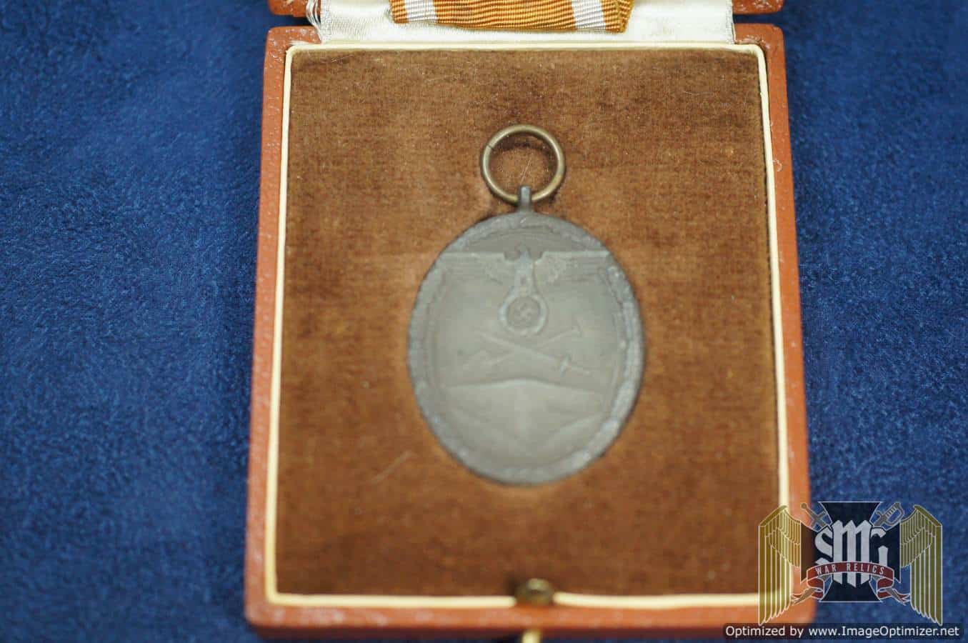 West Wall medal with post war case