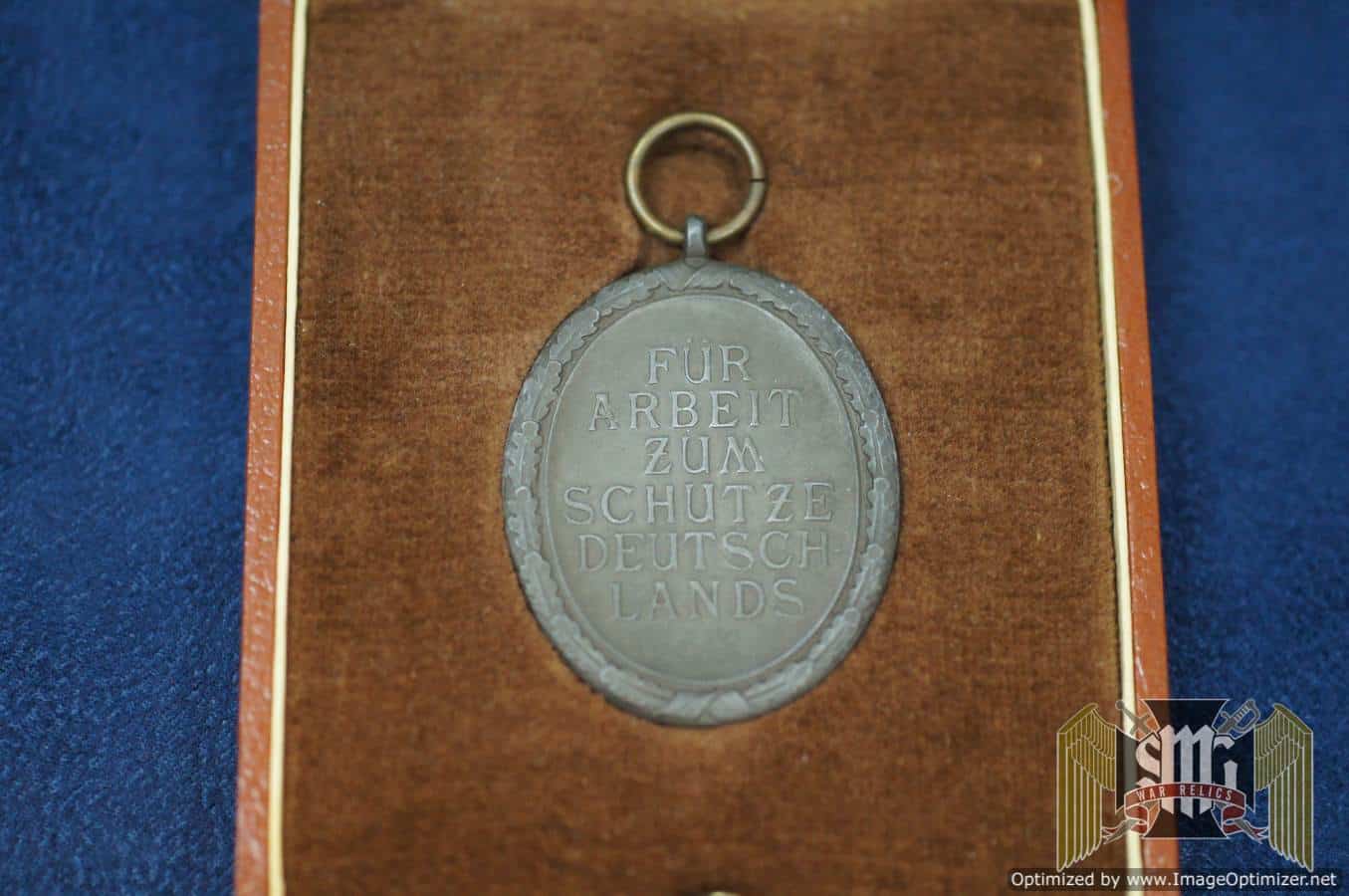 West Wall medal with post war case