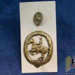 Horsemans Badge in Bronze with stickpin on sales card