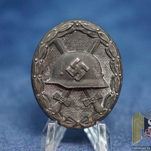 Black wound Badge Maker marked 65