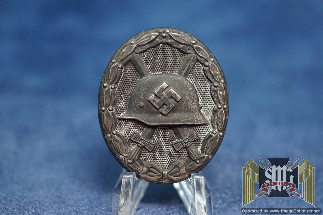 Black wound Badge Maker marked 65