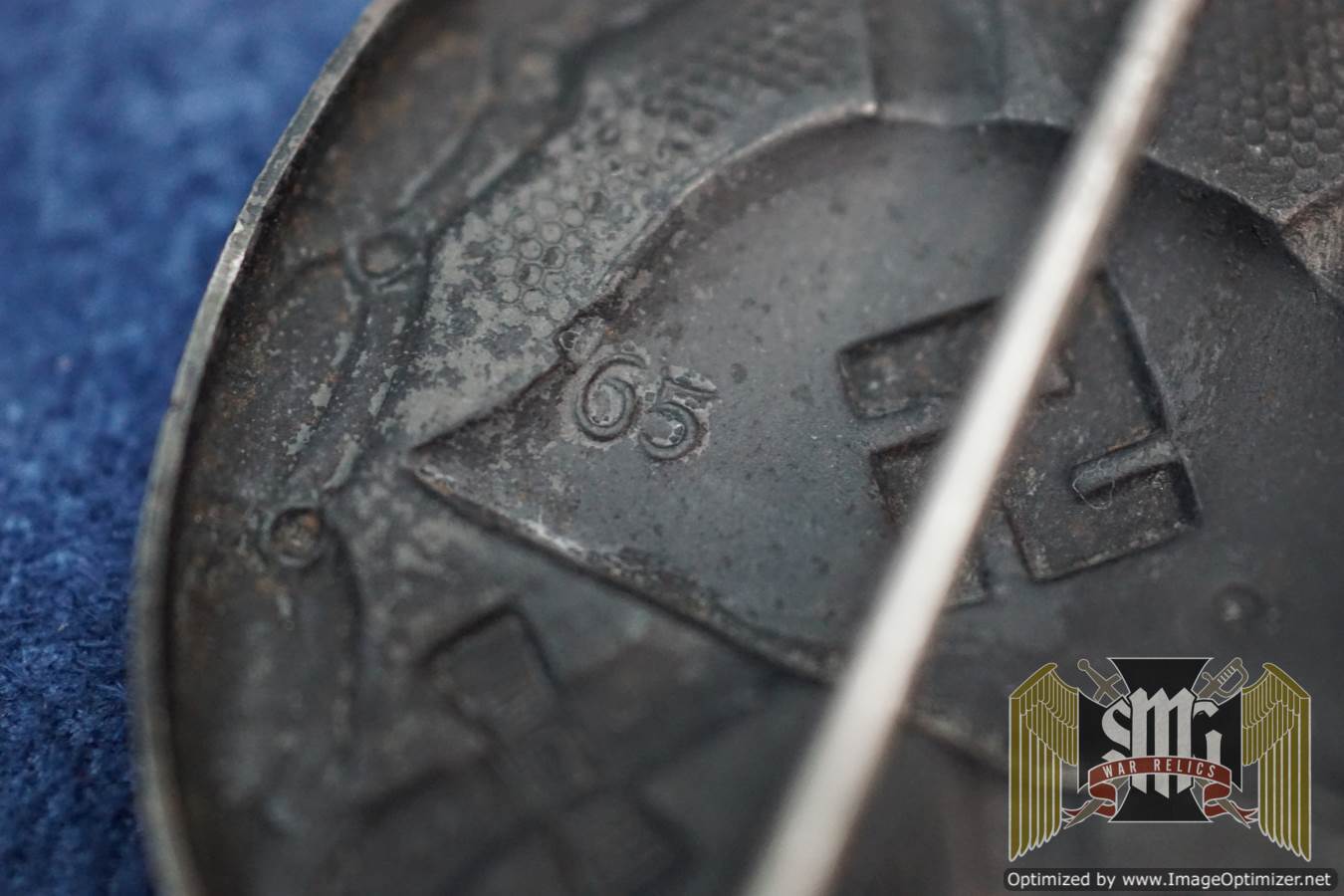 Black wound Badge Maker marked 65