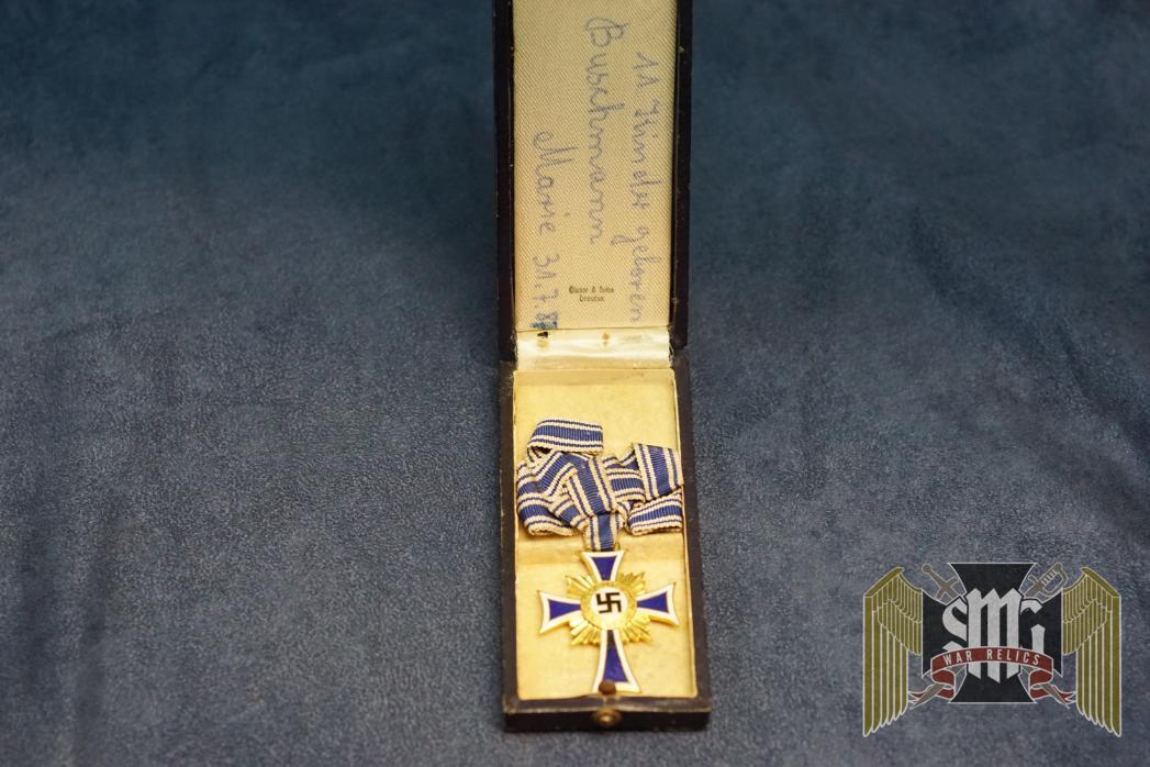 Cased Mother's Cross in Gold with note Written inside cover