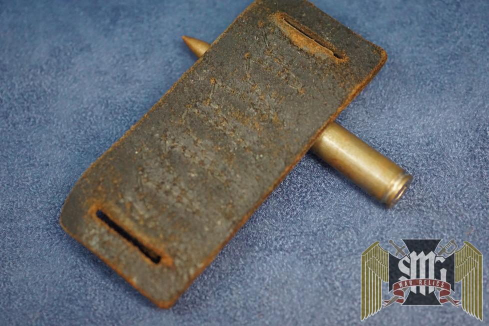 I'm selling this just how it was found. The bullet is a deactivated and swastika embellished. 