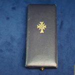 Cased mothers cross in gold by Friedrich Linden