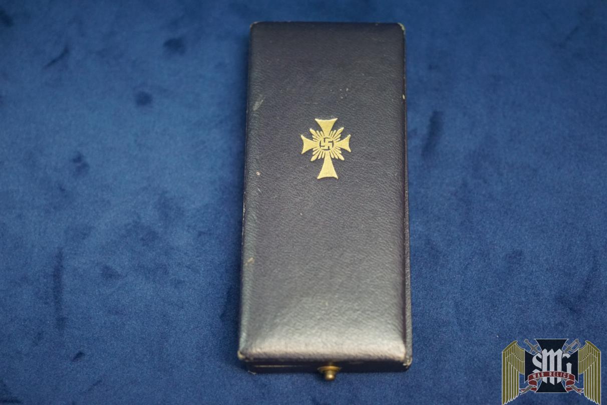 Cased mothers cross in gold by Friedrich Linden