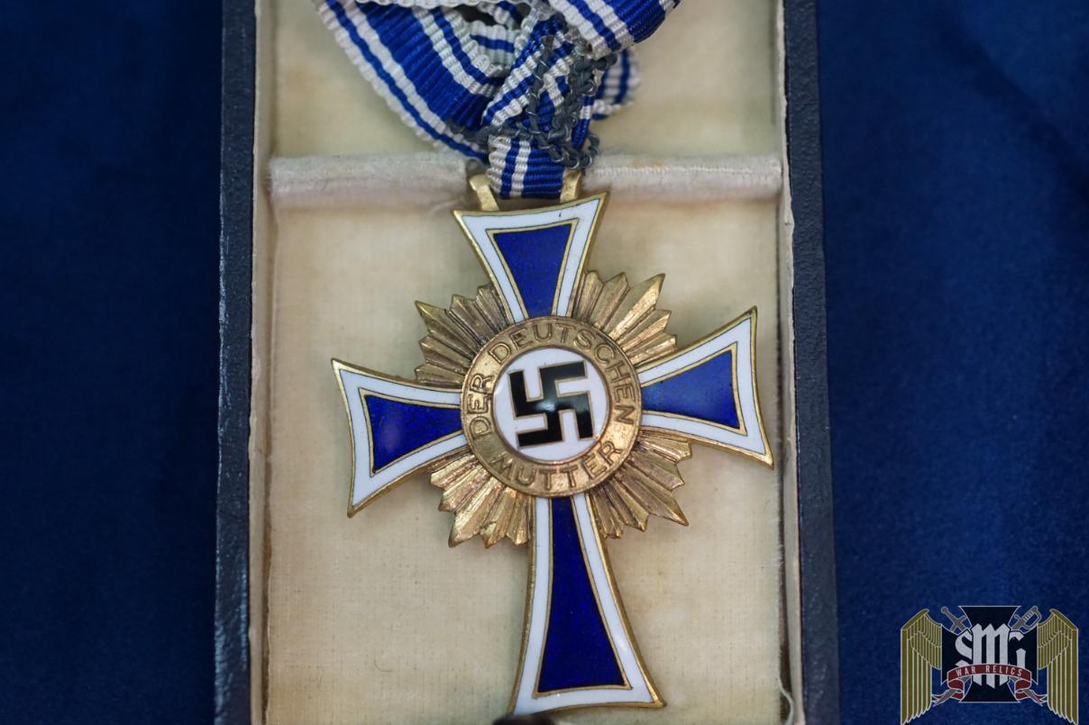 Cased mothers cross in gold by Friedrich Linden