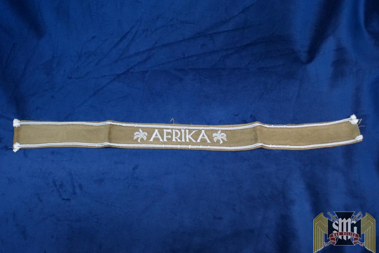 A beautiful camel felt cuff with light wear and typical white cordage tufts showing.