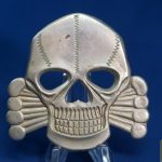 British Made Skull and Cross Bones cap badge