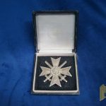 Cased First Class War Merit Cross w/repair with Swords by Deschler Marked “1” in Tombak