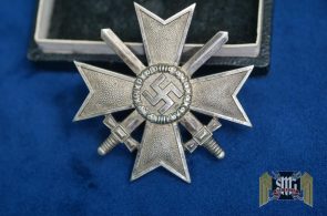 Cased First Class War Merit Cross w/repair with Swords by Deschler Marked “1” in Tombak