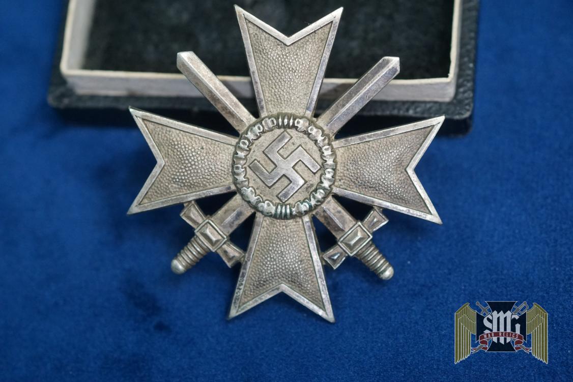 Cased First Class War Merit Cross w/repair with Swords by Deschler Marked “1” in Tombak