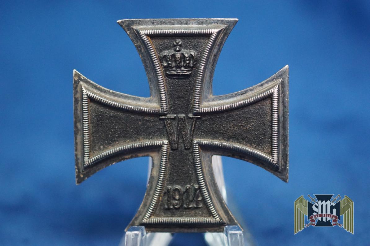 A super attractive cross! Gorgeous rough textured core that is nearly perfect. Shows just a hint of oxidation around the inside rim. Flat block hinge and S-W marked on the pin. 